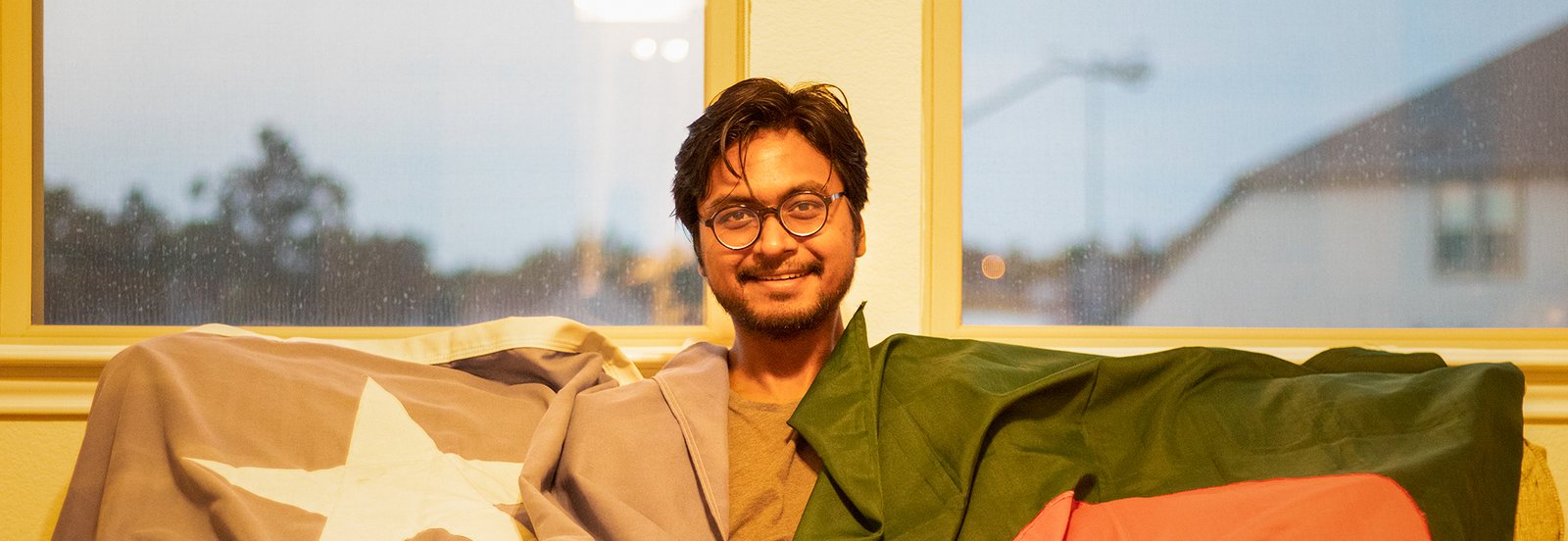 Musa Ibne Mannan with the flags of Bangladesh and Texas